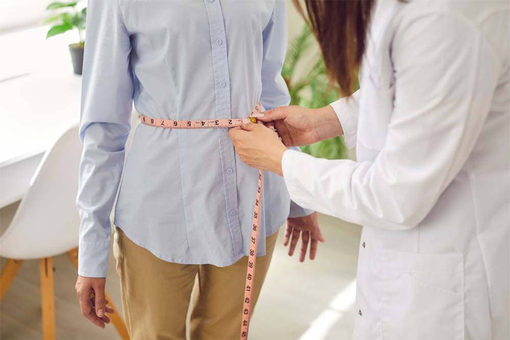 Medical weight loss in Columbia MD program helping a patient overcome weight plateaus