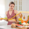 Woman measuring waist while preparing healthy foods at a weight loss clinic near Columbia MD