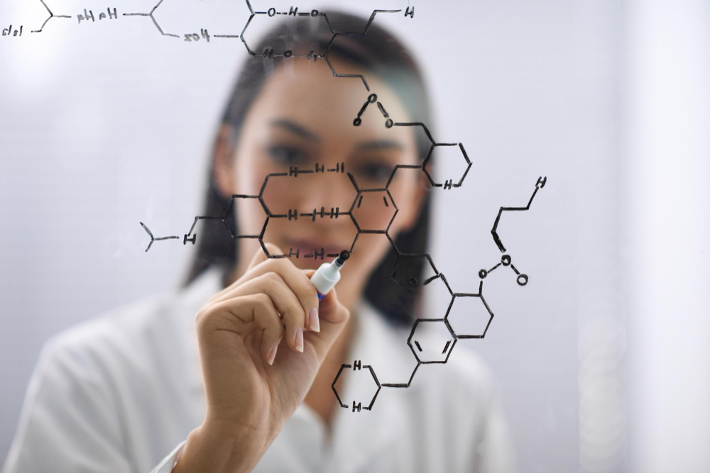 Scientist drawing chemical molecular structure representing bioidentical hormones