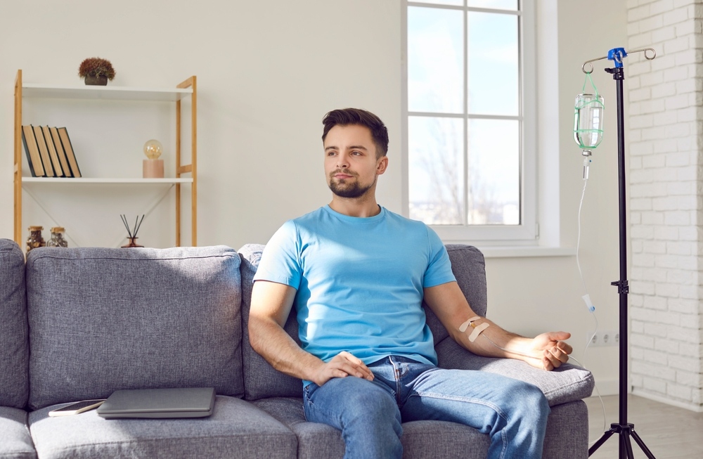 Man relaxing during an IV hydration therapy in Clarksville MD at Lizabelly Medspa